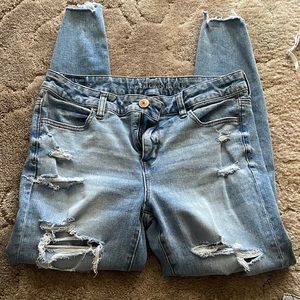American Eagle Jeggings. Light blue in color with holes down both legs.